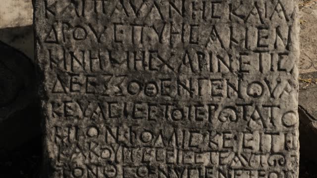 Ancient Greek writings chiseled on stone
