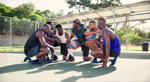 Leader, teamwork or huddle for motivation on basketball court planning a strategy or mission. Training game, coaching people or athletes in group for talking, fitness or support in a sports match