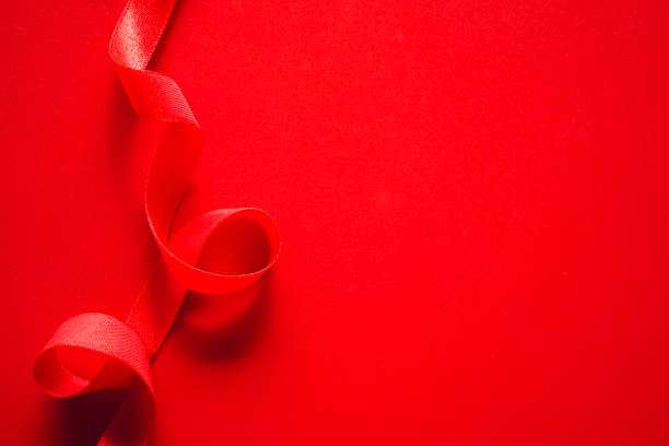 istock red satin ribbon frame on red background, Gift or Love background 2014730502