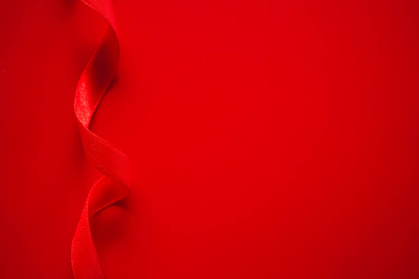 istock red satin ribbon frame on red background, Gift or Love background 2014730513