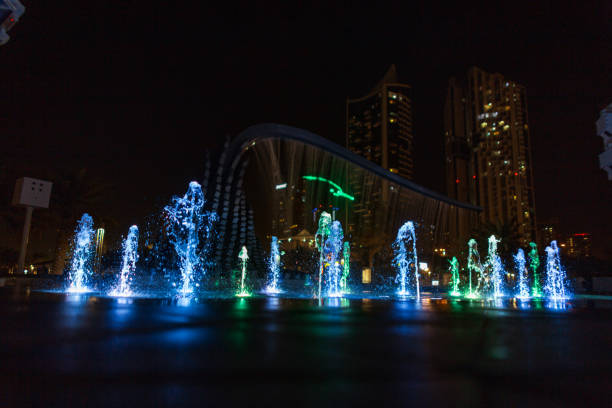 Free Stock Photo of A water with a fountain in front of a city at night ...