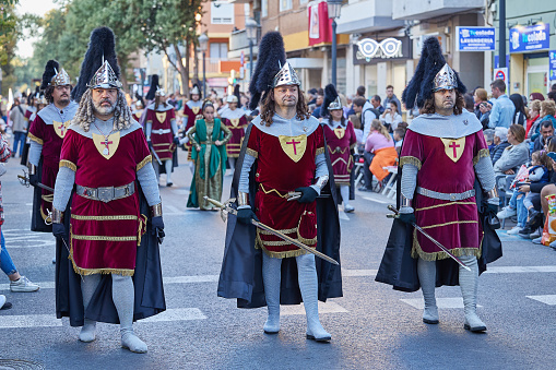 Valencia, Spain - April 7, 2023: Procession in historical costumes as part of Holy Week procession on the street.