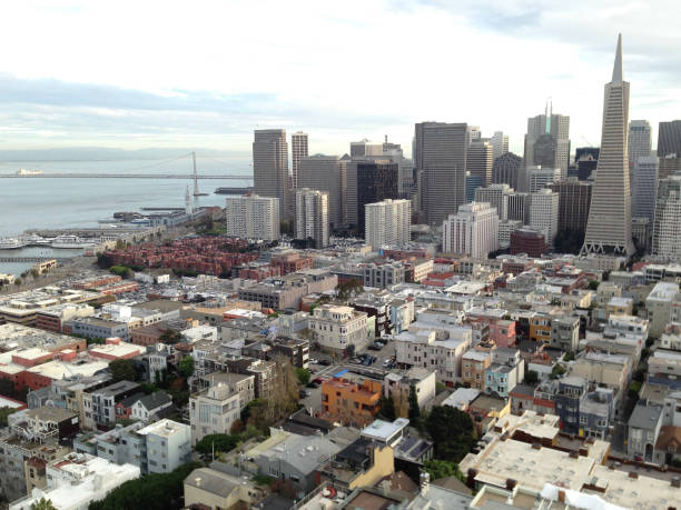 San Francisco, California, United States - December 08, 2014: Towering skyscrapers dominate the skyline, casting their impressive shadows over the bustling streets below, as the vibrant city of San Francisco hums with life and excitement.