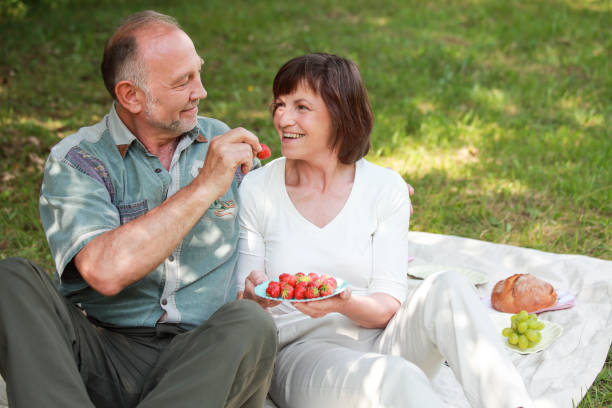 istock Senior couple on picnic having fun 2014782024