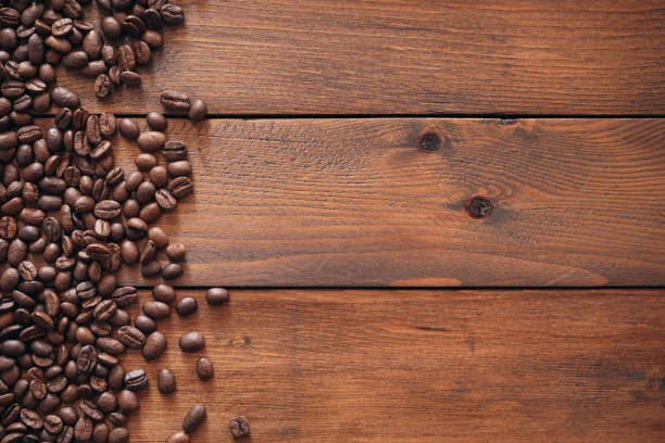 istock Coffee beans on old wood background with copy space 2014785740