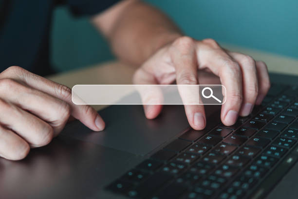 istock Close-up of Hands Typing Search Query 2014799910