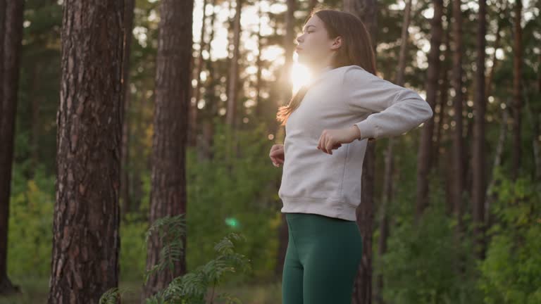 Woman performs jumping exercises in place