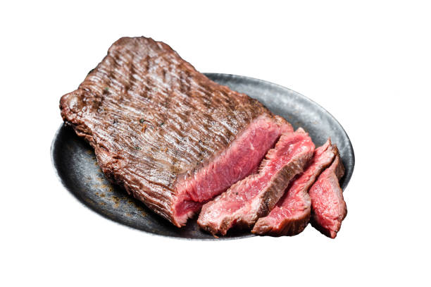 istock Grilled Flap or Flank Steak, sliced on a plate.  Isolated on white background.  Top view. 2014861585