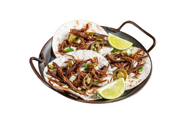 Spicy Beef Barbacoa Tacos with Cilantro and Onion.  Isolated on white background.  Top view.