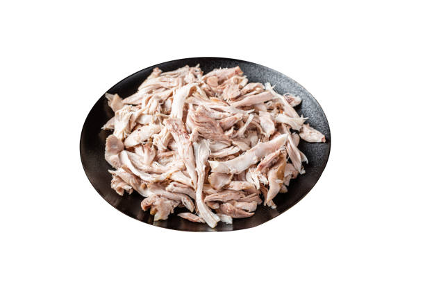istock Shredded chicken meat in a plate.  Isolated on white background.  Top view. 2014862695