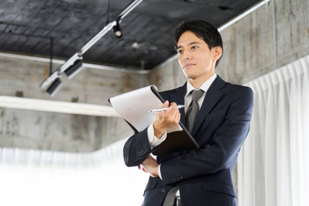 istock Businessman collecting information through questionnaires 2014868565