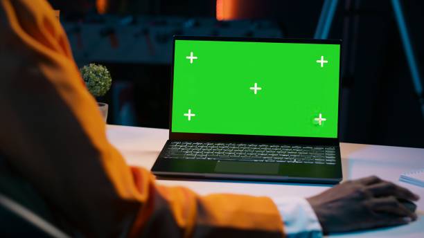 istock African american girl working with device showing greenscreen layout 2014874660