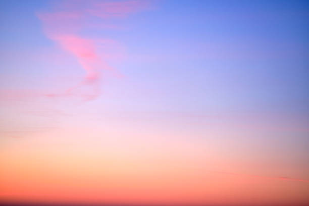 istock Clear transparent cirrus clouds on a red sunset sky 2014883973