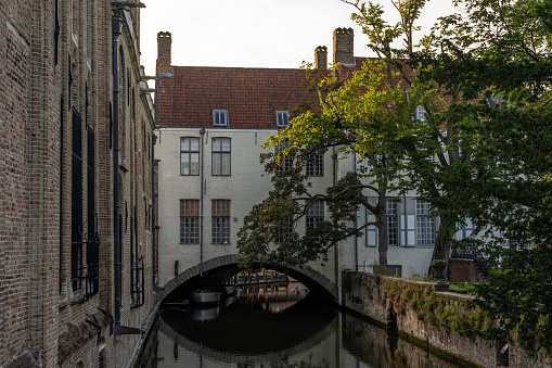 Bruges, Belgium - July 06, 2023: Bonifacius bridge (Bonifaciusbrug) zone in the old town of the beautiful city of Brugge in Belgium, with its historic facades.