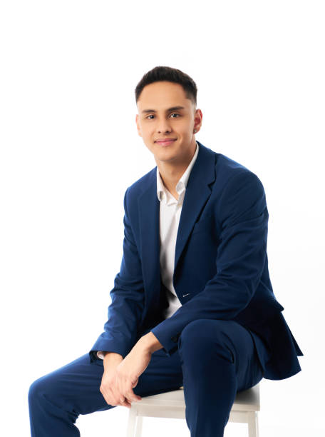 istock Young happy smiling entrepreneur young man sitting isolated on a isolated background 2014930453