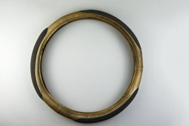 istock Old shabby steering wheel cover on a white 2014970262