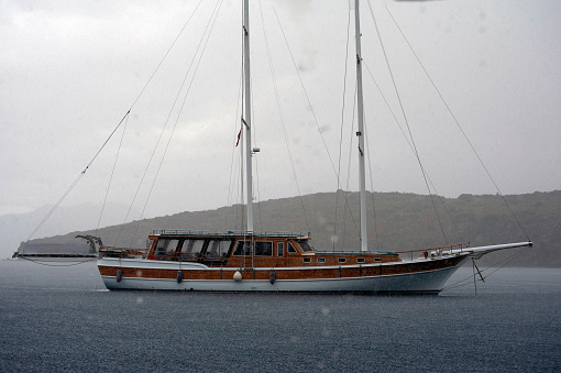 Anchored yacht on rainy day