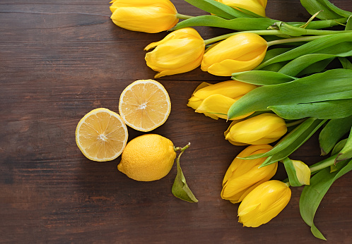 yellow tulips and green apples, lemon on white background