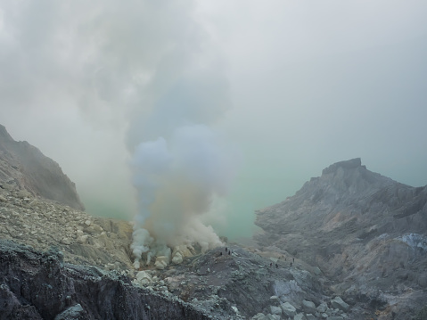 A lake full of natural Sulfuric acid and hydrogen sulfide gas inside the volcano carter at Kawah Ijen, East Java, Indonesia.