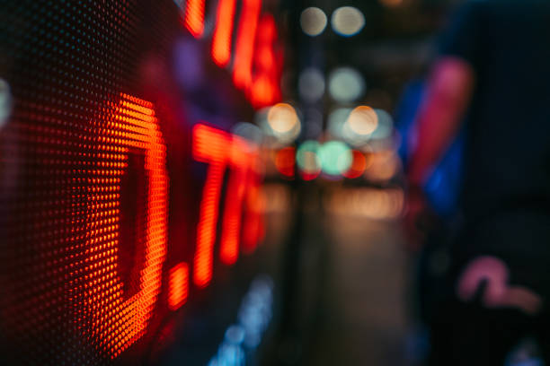 Digital Stock Market Display in an Urban Setting at Twilight