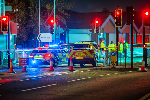 Emergency road closure with policemen in the background in england uk.