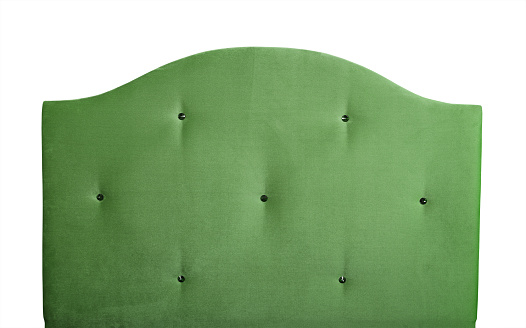 Pastel green soft velvet fabric shaped bed headboard with strass crystal rhinestones, isolated on white background, front view