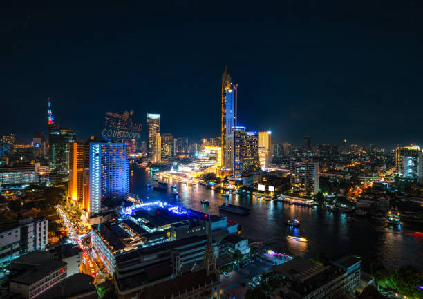 istock New Year's Countdown Nighttime Cityscape: Bangkok Skyline Illuminated by Evening Lights with Aerial View of Urban Skyscrapers and Busy Traffic 2015067781