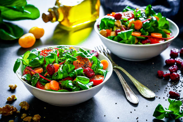 Healthy eating. Two fresh salad bowls and ingredients.