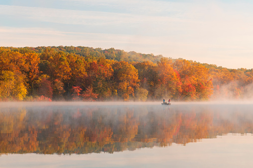 Elverson, USA - October 18, 2020. People fishing at Hopewell Lake in French Creek State Park, Elverson, Pennsylvania, USA