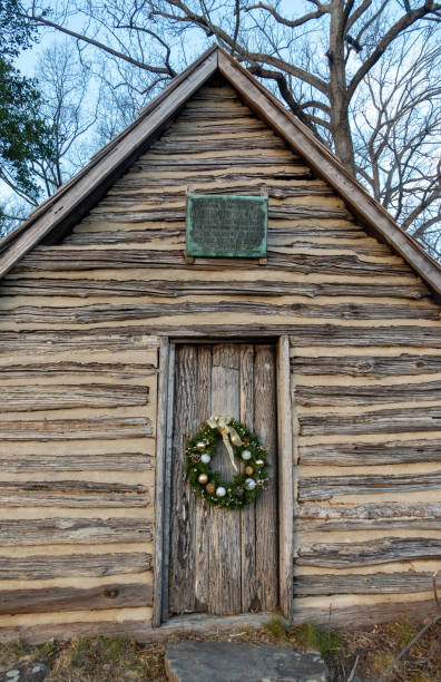 King of Prussia, USA - December 28, 2020. Wreath on door of log house at Valley Forge National Historic Park, Pennsylvania, USA