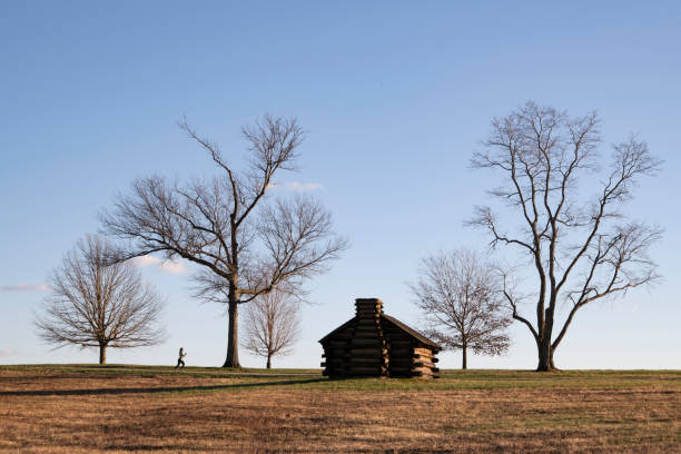 King of Prussia, USA - December 6, 2020. A lady jogging in Valley Forge National Historic Park, Pennsylvania, USA