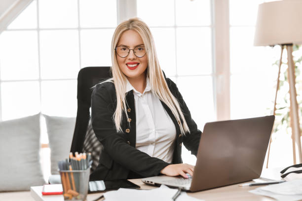 istock Confidence Shown By Female CEO At Her Office 2015128381
