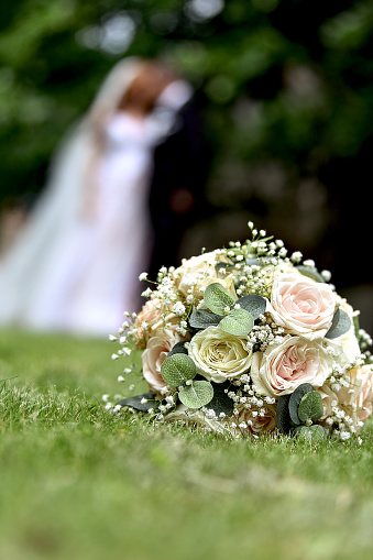 Couple behind wedding flower