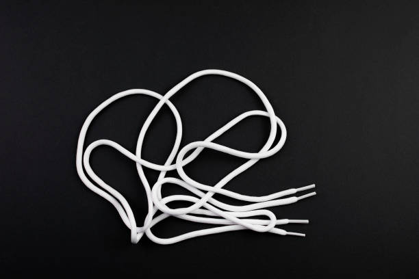 istock White long shoe laces on a black 2015166767