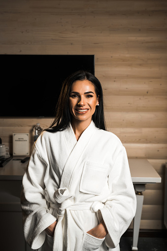 Young woman in a bathrobe posing in a massage room.Spa and massage concept