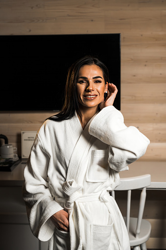 Young woman in a bathrobe posing in a massage room.Spa and massage concept