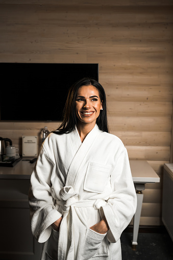 Young woman in a bathrobe posing in a massage room.Spa and massage concept