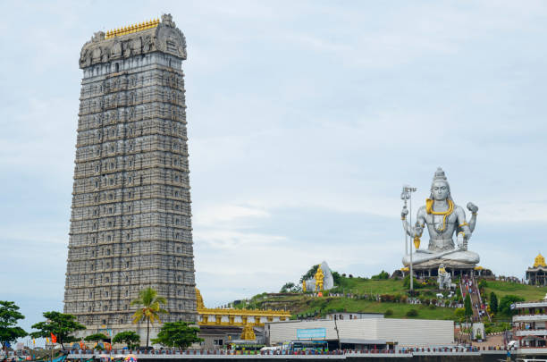 Lord Murdheshwar statue with temple tower