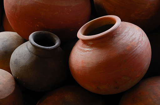Clay jugs and a pots, a set of ancient utensils for drinking water or milk.