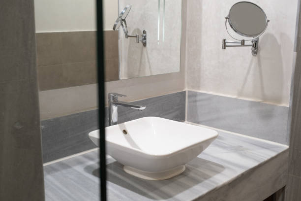 istock faucet for water and white sink on marble counter 2015259110