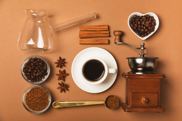 istock Ingredients for making coffee. Moka pot, Turkish coffee pots (cezve), coffee grinder with coffee beans, milk, sugar and spices on a white background. Drink preparation concept. Flat Lay.Copy space. 2015263398