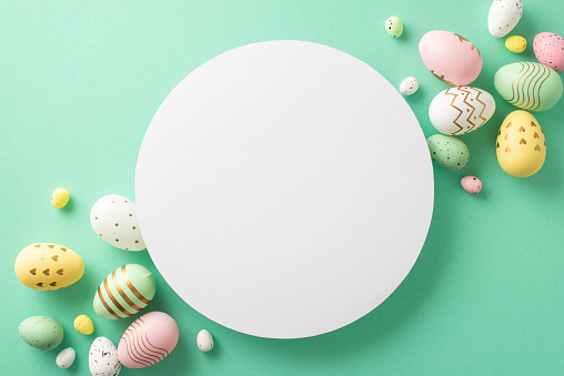 Easter delight scene: top view colorful eggs on a turquoise base, providing a perfect circular space for your text or promotion