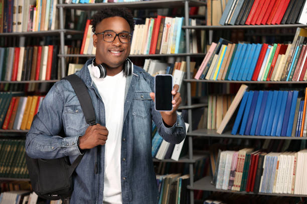 istock College student preparing for exams in reading room with mobile phone 2015282723