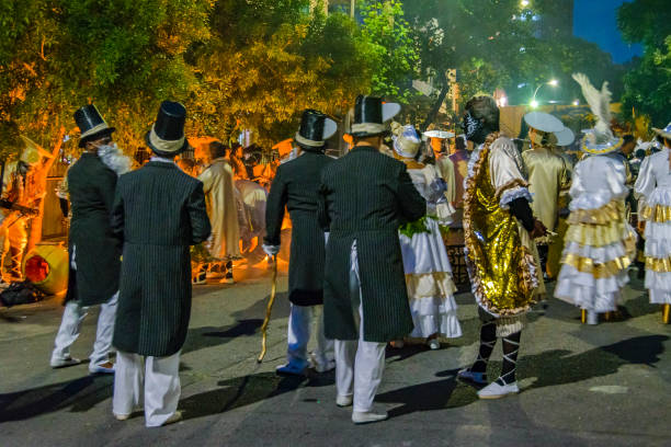 Montevideo, Uruguay -  February 9, 2024: Comparsa group at street waiting to calls parade carnival, montevideo, uruguay.
