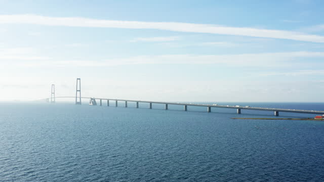 Great Belt Bridge With Moving Vehicles On Calm Seas