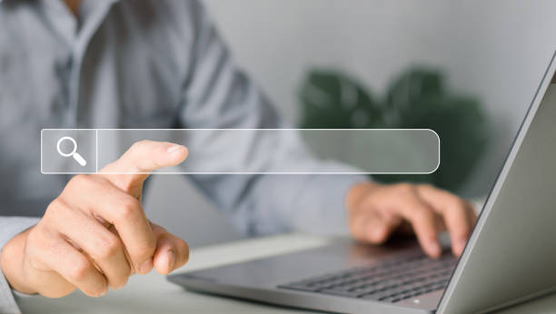istock information search sign Human hand touching search bar for Search Engine Optimization or SEO to find information or information by internet connection, network, database, information system. 2015350259