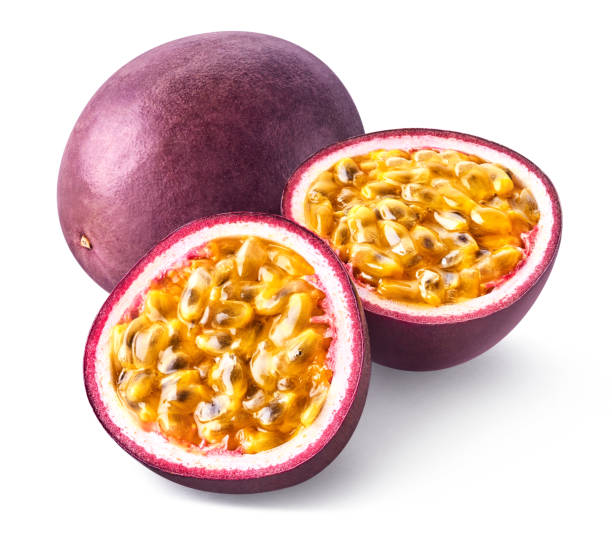 istock Whole and two halves of fresh passion fruit on white background 2015350292