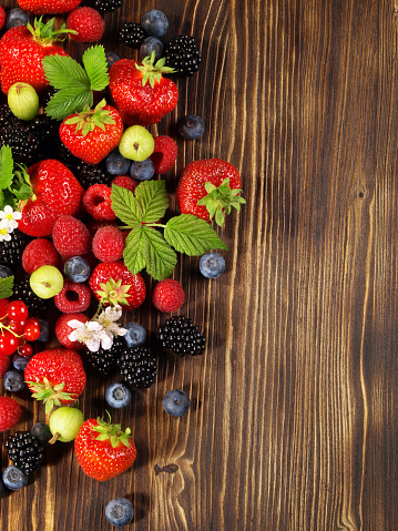 Mixed Berries on wooden Background