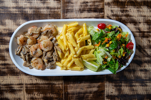 Overhead image of Shrimps with Mushrooms, Pasta and Salad