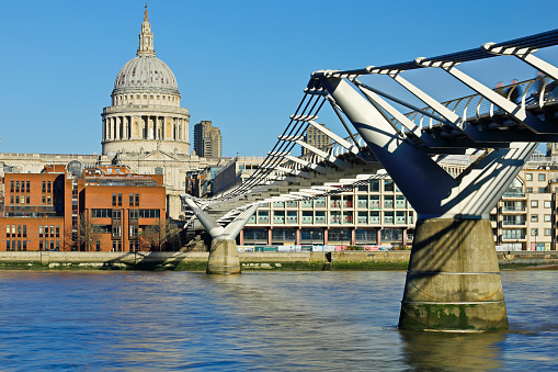 daytime view of St. Paul's Cathedral and the Millenium bridge (London, England).